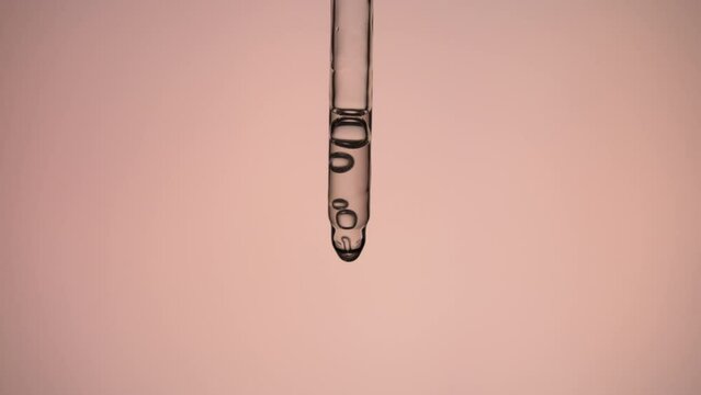 Applying cosmetic product on pink background