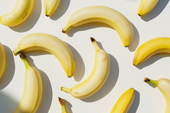 a group of bananas on a white surface