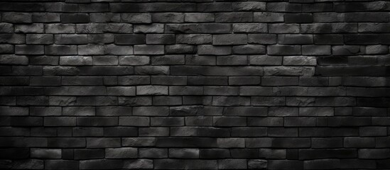 A close-up black and white shot of a textured brick wall painted in black, showcasing the intricate...