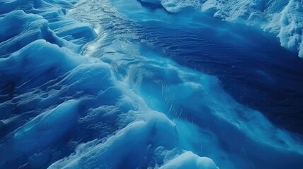 Close-Up View of Deep Blue Ice Textures in a Frozen Landscape.