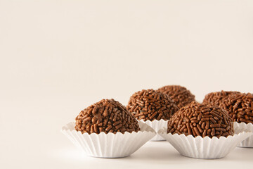 Brigadeiro brazilian chocolate balls party candy with chocolate flakes front view clean background