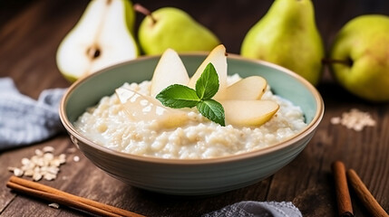 Oatmeal porridge with pear in white plate. Close