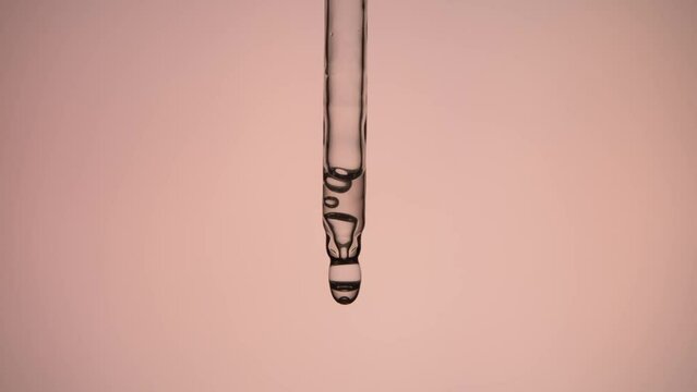 Applying cosmetic product on pink background