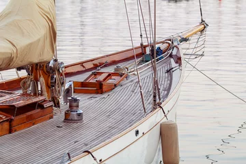 Fotobehang An image shows an old-fashioned yacht docked © Brother's Art