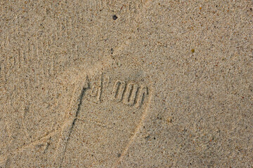 Shoe print surface on the beach There are 100% number patterns.