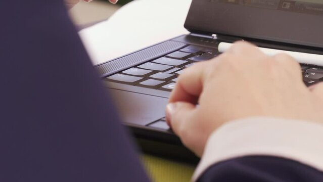 businessman typing on comuter keyboard