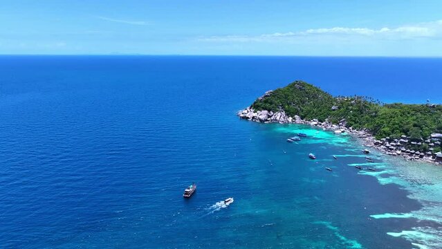 Aerail view with tourist boat of the tropical seashore island in turquoise sea Amazing nature landscape	