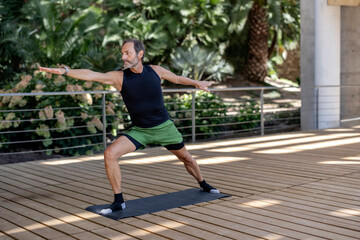 Senior man stretching posture yoga training on mat