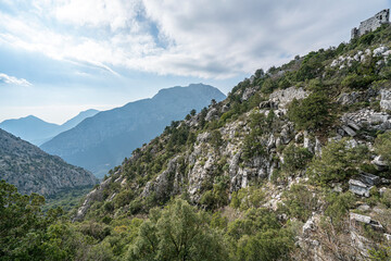 Fototapeta premium The scenic view of Termessos ancient city and the theater from Güllük Mountain, Antalya, Turkey