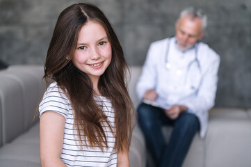 Portrait of happy smiling child after good consultation with pediatrician