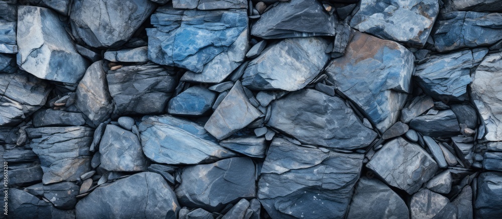 Poster a collection of rocks piled together, showcasing a variety of shapes and sizes. the rocks are closel