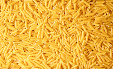 Pasta penne background. Raw pasta close-up. Italian Pasta background