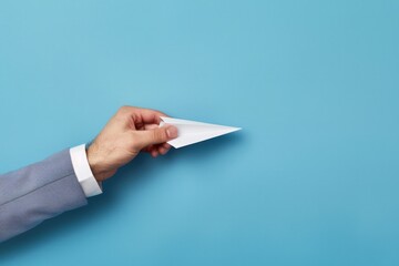 Businessman hand with paper plane, concept of business, innovation and creativity.