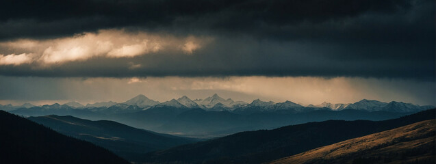 Majestic Mountain Range Beneath Cloudy Sky