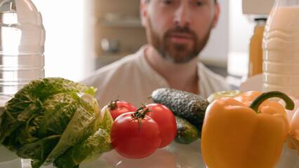 Point of view POV inside refrigerator Caucasian man husband guy male homeowner chef cooker open...