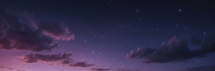 Naklejka premium Enchanting Night Sky Filled With Stars and Clouds