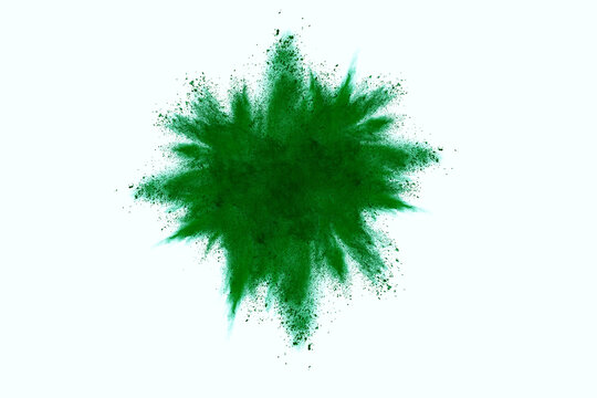 Green powder explosion on white background. Colored cloud. Colorful dust explode. Paint Holi