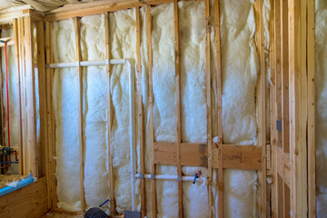 An insulation wall is being constructed for new residential building