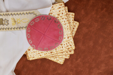 Passover unleavened bread Matzah is part of traditional Jewish ritual, kippah tallit are symbols of...