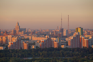 Ostankino tv tower, residential buildings, forest at evening in Moscow, Russia