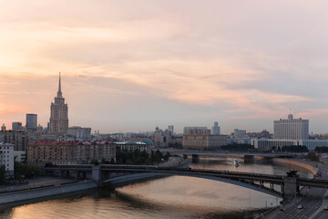 Fototapeta na wymiar Smolensky Metro Bridge with moving train at evening in Moscow, Russia
