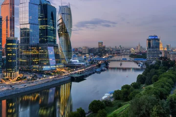 Foto op Plexiglas  Moscow International Business Center and Bagration bridge at night. Investments in Moscow International Business Center was approximately 12 billion dollars © Pavel Losevsky