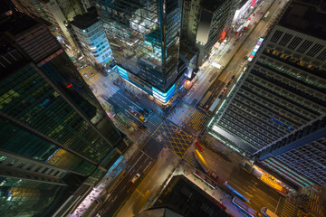 Skyscrapers and road at night in Hong Kong city, China, top view - obrazy, fototapety, plakaty