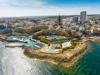 Landscape panorama of f St. Julian's city, modern high buildings. Maltese island, Mediterranean sea