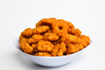 Sakura ribut, fried dough with flower shape, savory taste. Snack from Indonesia. Isolated on white background