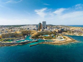 Landscape of f St. Julian's city, modern high buildings. Day. Maltese island, Mediterranean sea