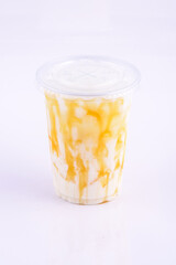 Iced Caramel Milk. Beverage for summer with brick wall background.