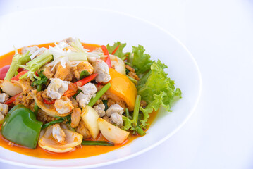 Sweet and sour crab stir fried on the white dish.