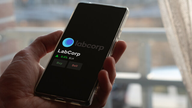 March 02nd 2024 Burlington, North Carolina. The logo of LabCorp on the screen of an exchange. LabCorp price stocks, $LH on a device.