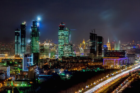 Skyscrapers of Moscow City business complex and road with moving cars at night in Moscow, Russia. I have only one version of the photo with sharpening