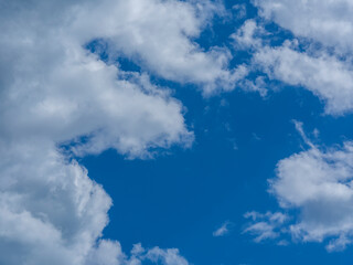 fluffy clouds and blue sky background