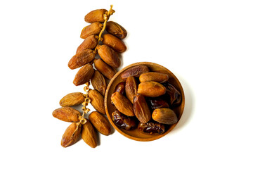 top view of dried dates served on a wooden isolated on white background