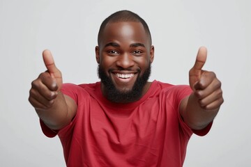 Photo of happy cheerful black male model points index finger aside, keeps mouth opened, shows tongue, attracts your attention to blank space, invites you going there, recommends product  - obrazy, fototapety, plakaty