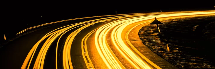 Papier Peint photo Autoroute dans la nuit orange car lights at night. long exposure