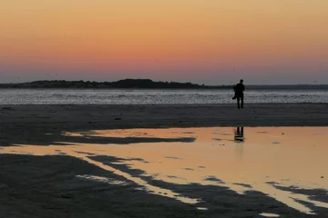 Gardinen sunset on the beach © Xuan