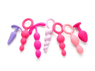 anal plugs in different shades of pink isolated on white background