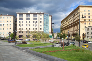 Street and Khitrovskaya square with benches in Moscow, Russia on sunny day