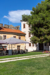 Fototapeta na wymiar Juraj Dobrila Square, recreation area next to former entrance to Bishop's Palace, Porec, Croatia, Istria