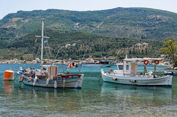 Fototapeta na wymiar Traditional wooden fishing boats at the harbour of Vathy in Ithaka island, Greece