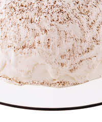White mousse cake on white plate