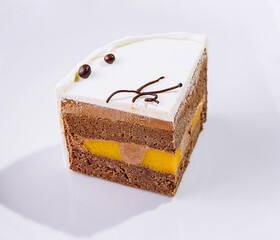 top view of a cream cake on white plate