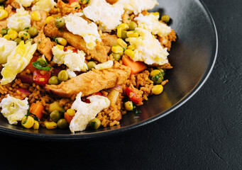 Mediterranean rice dish with eggplant, vegetables, chicken meat and feta cheese