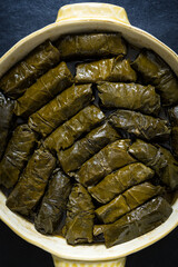Dolma, stuffed grape leaves  with rice and meat. Delicious caucasian and mediterranean cuisine. Top view. Full frame.