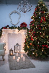 Christmas tree and garlands with vintage fireplace in studio
