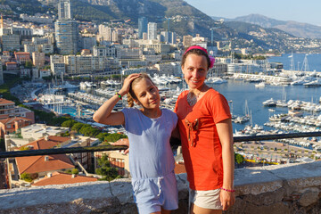 Mother with her daughter on observation deck of palace Grimaldi