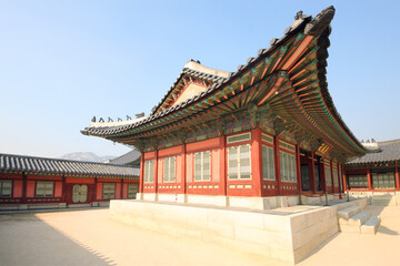 Houses with beautiful, decorated roof in Gyeongbokgung, Seoul at autumn day